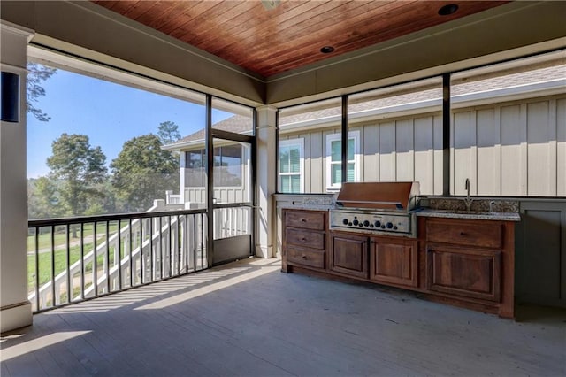 sunroom with sink and wooden ceiling