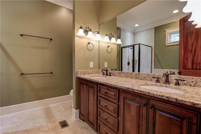 bathroom with tile patterned flooring, a shower with shower door, vanity, and toilet