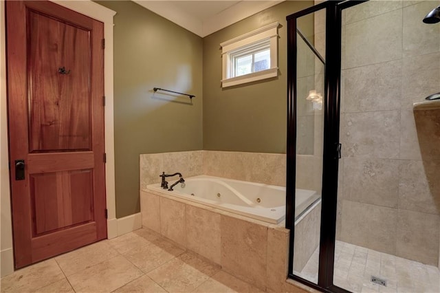 bathroom with tile patterned floors and separate shower and tub