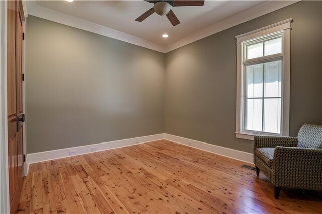 living area with light hardwood / wood-style flooring and ceiling fan