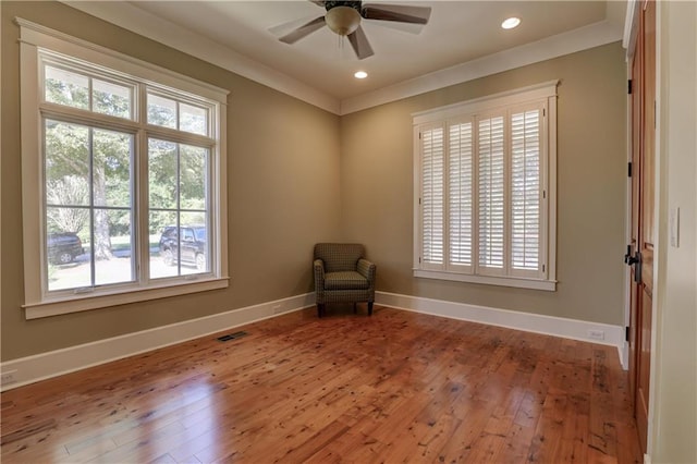 unfurnished room featuring hardwood / wood-style floors and ceiling fan