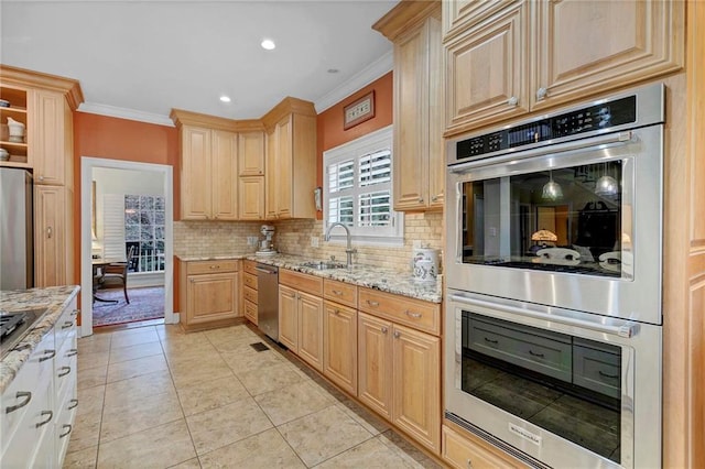 kitchen featuring sink, crown molding, appliances with stainless steel finishes, light stone countertops, and light brown cabinets