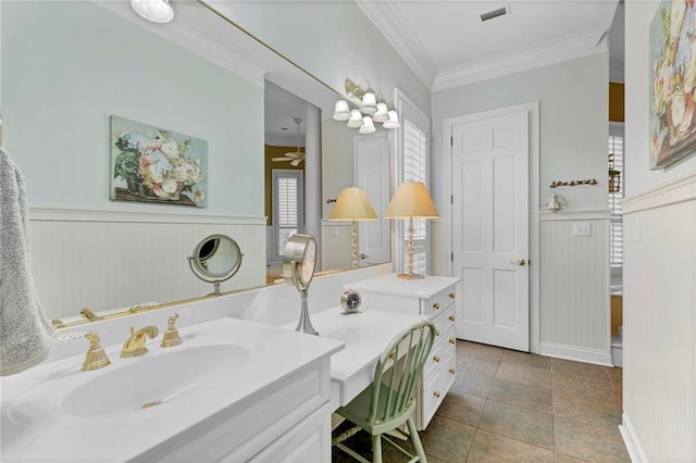 bathroom with crown molding, ceiling fan, vanity, and tile patterned flooring