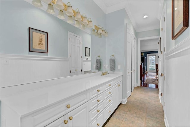 bathroom with vanity, tile patterned floors, and ornamental molding