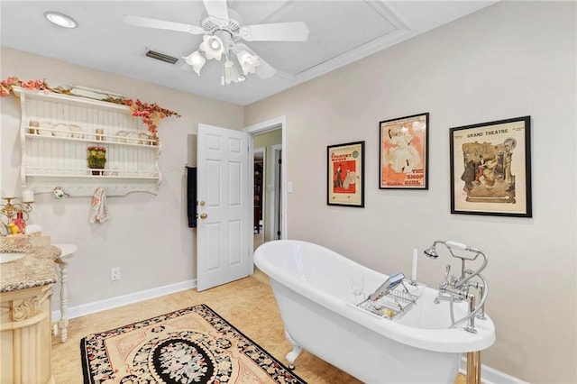 bathroom featuring vanity, tile patterned flooring, a bathtub, and ceiling fan