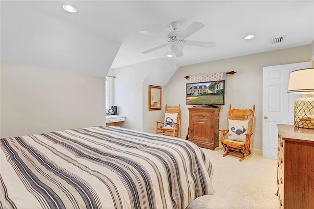 bedroom with ceiling fan, lofted ceiling, and light carpet