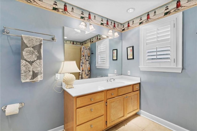 bathroom featuring tile patterned flooring and vanity