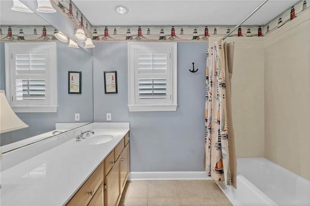 bathroom featuring shower / bathtub combination with curtain, vanity, and tile patterned floors