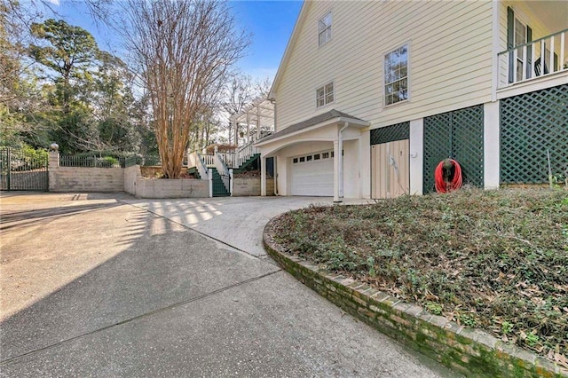 view of side of home featuring a garage