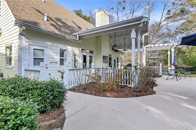 exterior space featuring a patio, ceiling fan, and a pergola