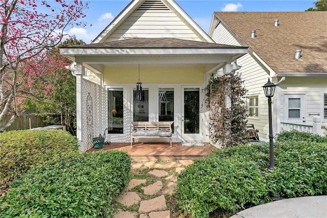 back of property featuring covered porch