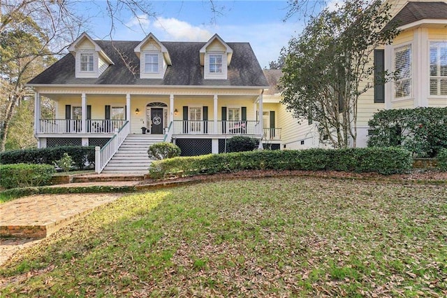 cape cod-style house with a front yard and a porch