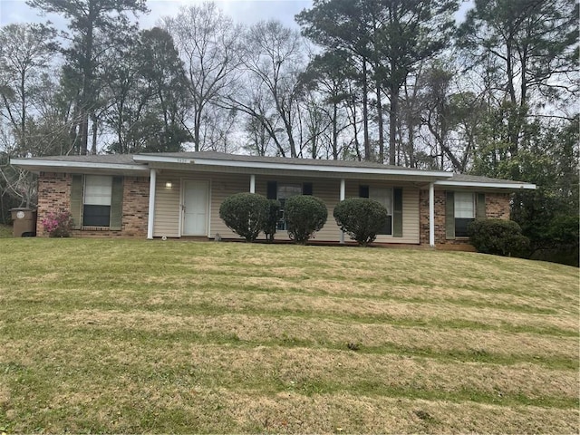 single story home featuring a front lawn and brick siding