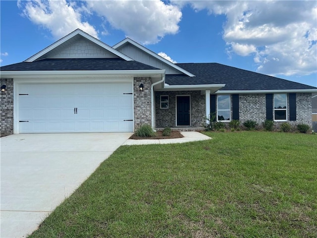 view of front facade featuring a garage and a front lawn