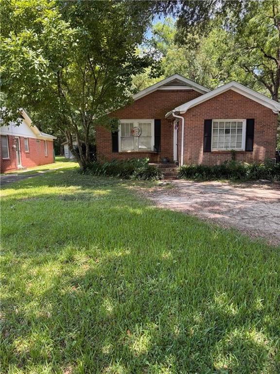 707 Mandrell St, Mobile, AL 36606 - view of front of home featuring brick siding and a front lawn