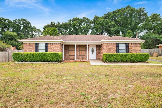 ranch-style home featuring a front yard