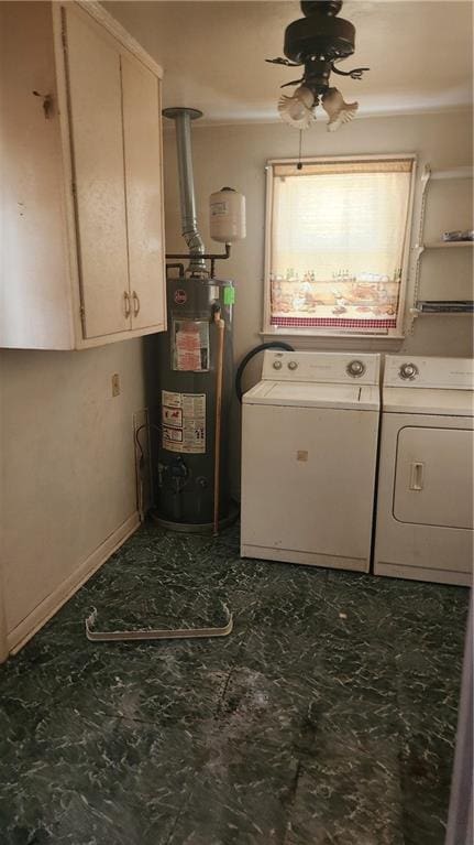 clothes washing area featuring ceiling fan, gas water heater, independent washer and dryer, tile flooring, and cabinets