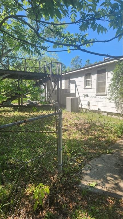 view of yard with central AC