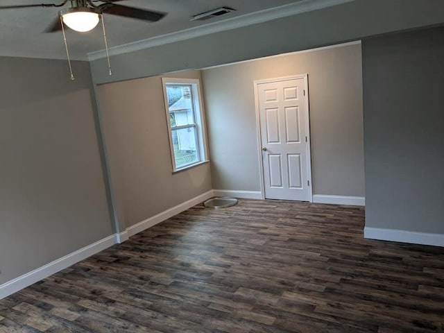 interior space with dark hardwood / wood-style flooring, ceiling fan, and crown molding