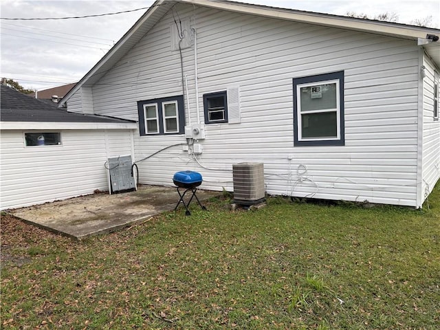 back of house featuring a yard, a patio, and central AC unit