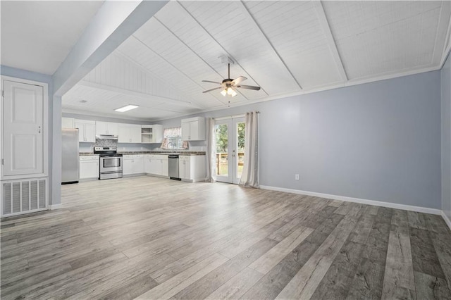 unfurnished living room with light wood-style flooring, a ceiling fan, visible vents, baseboards, and french doors