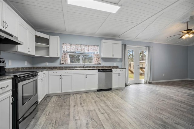 kitchen with open shelves, appliances with stainless steel finishes, dark countertops, and white cabinets