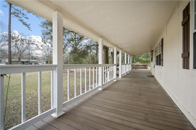 wooden deck featuring covered porch