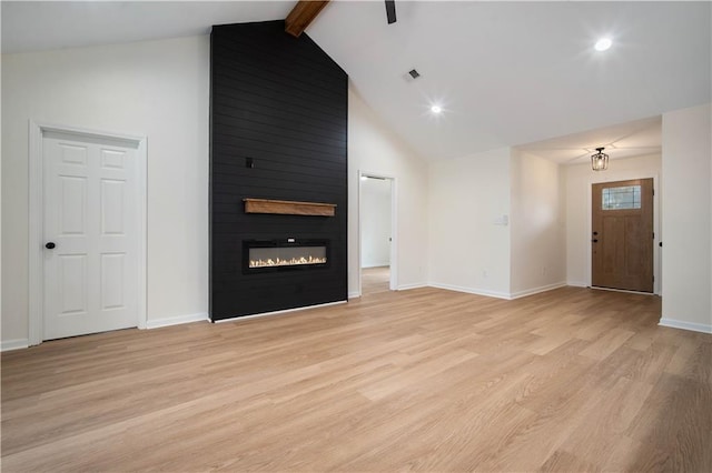 unfurnished living room with beamed ceiling, high vaulted ceiling, light wood-style flooring, a fireplace, and baseboards