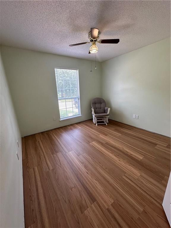 1010 Hamilton Bridges Dr E, Mobile, AL 36695 - spare room featuring wood finished floors, a textured ceiling, and ceiling fan