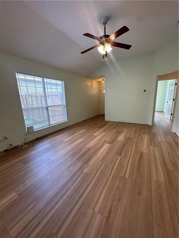 1010 Hamilton Bridges Dr E, Mobile, AL 36695 - spare room with wood finished floors, a ceiling fan, and vaulted ceiling