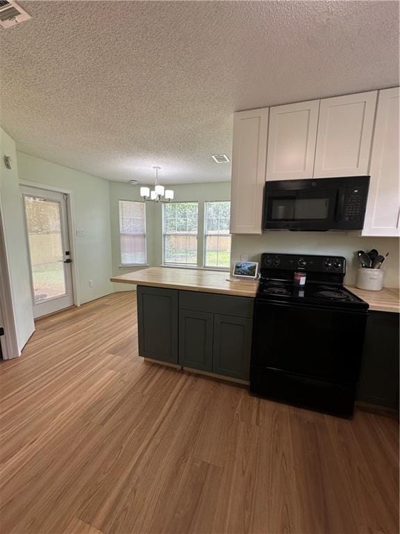 1010 Hamilton Bridges Dr E, Mobile, AL 36695 - kitchen featuring black appliances, a chandelier, light wood-style floors, white cabinets, and a textured ceiling