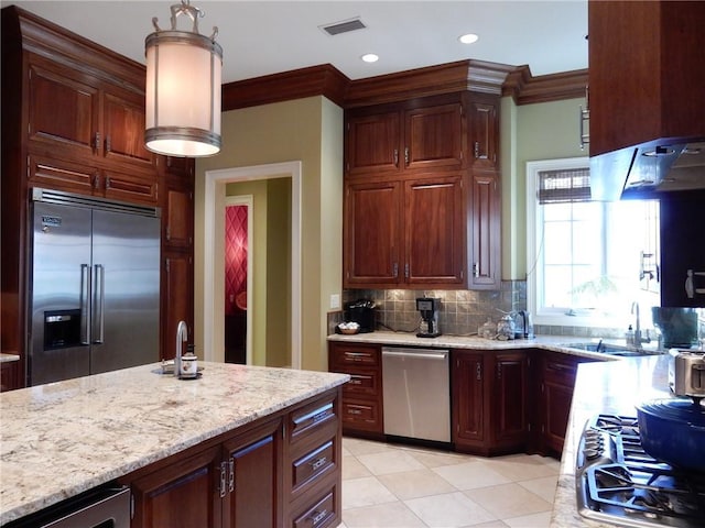 kitchen with tasteful backsplash, light tile floors, stainless steel appliances, light stone countertops, and ventilation hood