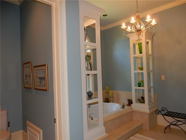 bathroom featuring a bath, a notable chandelier, toilet, and ornamental molding