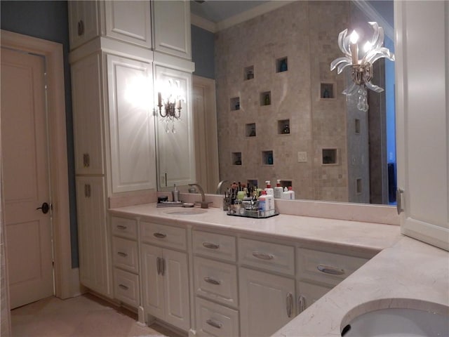 bathroom featuring tile floors, vanity, and crown molding