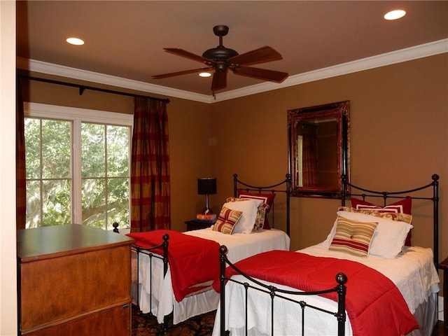 bedroom with ceiling fan and crown molding