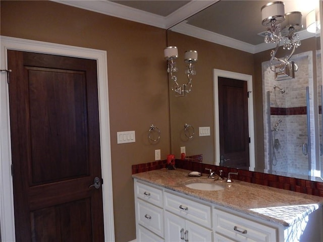 bathroom featuring vanity, walk in shower, a chandelier, and crown molding