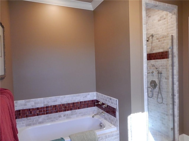 bathroom featuring shower with separate bathtub and ornamental molding