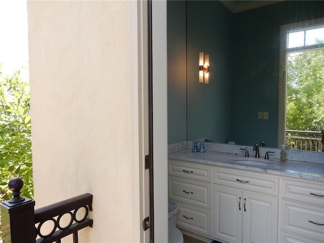 bathroom with toilet and vanity