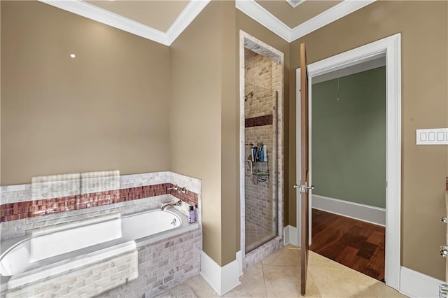 bathroom featuring crown molding, shower with separate bathtub, and tile flooring