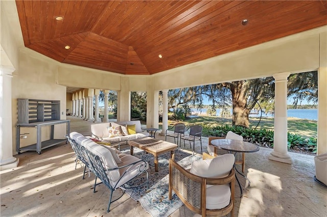 view of patio / terrace featuring a water view and an outdoor hangout area