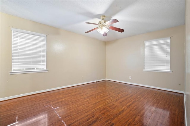 spare room featuring ceiling fan and wood-type flooring