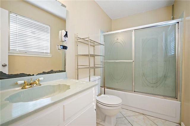 full bathroom featuring tile patterned floors, vanity, bath / shower combo with glass door, and toilet