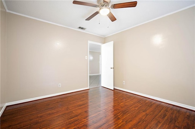 spare room with ceiling fan, ornamental molding, and hardwood / wood-style flooring