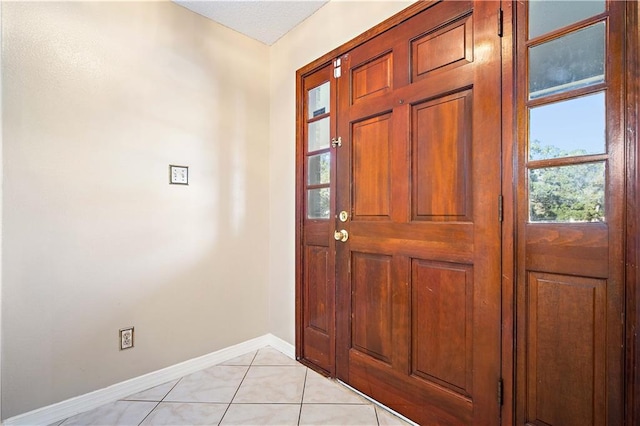 view of tiled foyer entrance