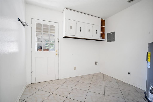 laundry room with electric panel, electric water heater, and light tile patterned floors