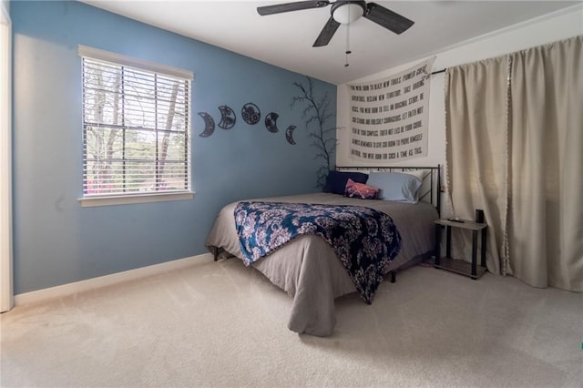 bedroom with baseboards, carpet, and a ceiling fan
