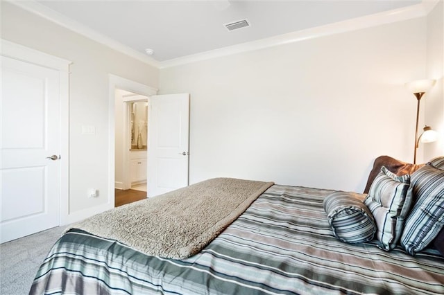 carpeted bedroom with ornamental molding