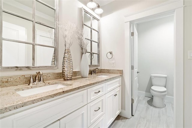 bathroom with vanity and toilet