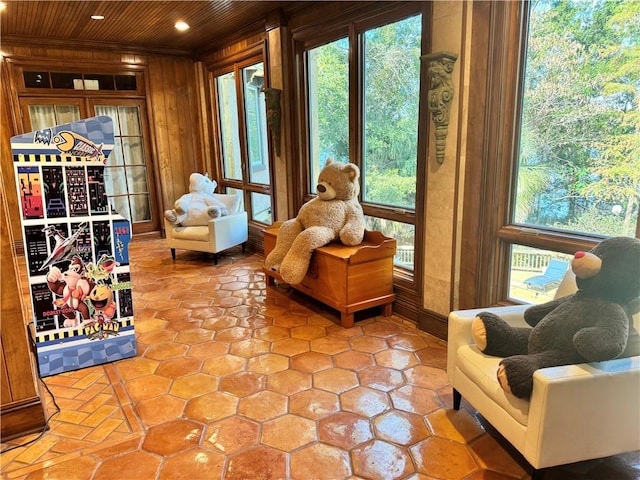 sunroom / solarium with a wealth of natural light and wood ceiling