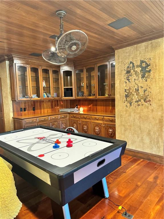 playroom featuring dark hardwood / wood-style flooring and wood ceiling